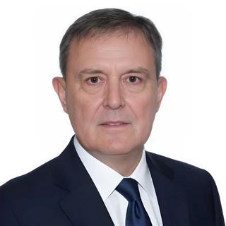 A photo of David Dixon, author of the Goulding System in dark suit and tie.